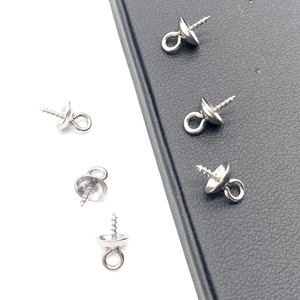 Macro shot of stainless steel screw eye pins with cap for DIY pearl jewelry making