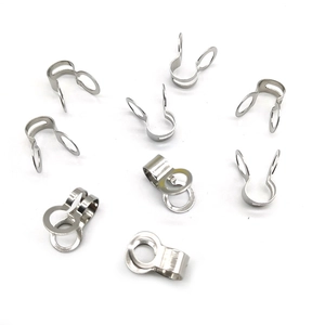 Close-up of stainless steel bead chain connectors and flat U-shape clasps for jewelry DIY
