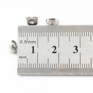 Set of three silver stainless steel butterfly earring backs with 5mm ruler measurement