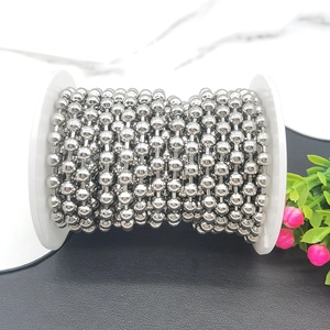 Polished silver stainless steel bead chain on white spool for DIY jewelry making