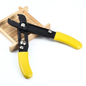 Detail of wire stripper pliers with yellow handle and adjustable size scale for jewelry making