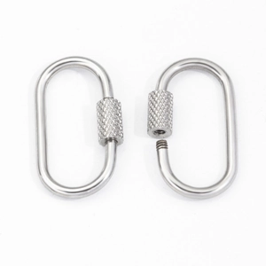 Macro detail of oval stainless steel screw lock carabiner with knurled surface for DIY jewelry