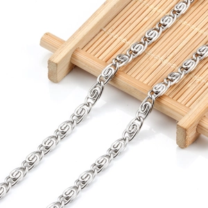 Polished stainless steel infinity link chain necklace for DIY jewelry on a bamboo mat