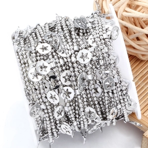 Polished stainless steel ball chain with hollow star pendants on a storage card