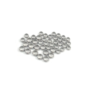 Close-up of polished stainless steel crimp beads for DIY jewelry making accessories