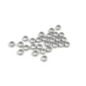 Close-up of polished stainless steel spacer beads with high gloss finish for DIY jewelry