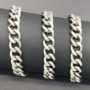 Three rows of 10mm high-polished stainless steel Cuban chains on a professional display