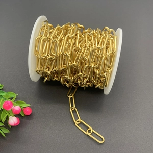 Golden stainless steel oval link chain on a spool for DIY jewelry necklace making