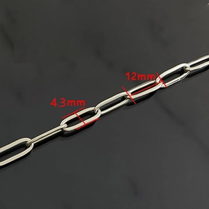 Macro shot of 4.3mm wide stainless steel flat paperclip chain links with 12mm length detail