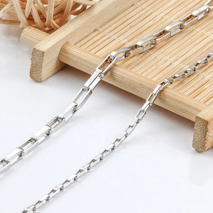 Macro shot of two different gauges of rectangular stainless steel chain links