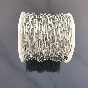 Close-up of a spool of silver stainless steel oval link chain for DIY jewelry making