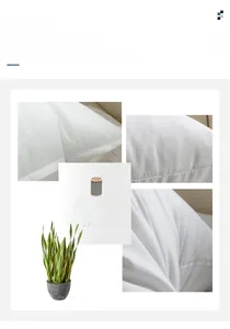 Detaillierte Nahaufnahme präziser Nähte und hochwertigem weißem Stoff eines minimalistischen Kissens