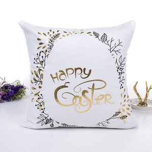 Easter pillow cover featuring golden Happy Easter text and botanical patterns on white fabric