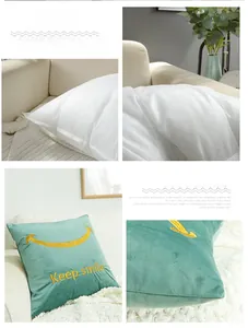 Detailed view of dark green velvet pillowcase with yellow smile embroidery and soft insert