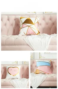 Detail view of modern laser bronzing cushion covers with geometric and heart patterns