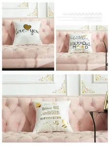 Detail of laser gold stamping pillowcases with heart and mermaid patterns on white fabric