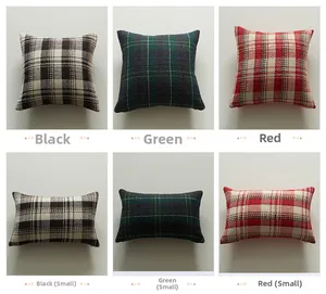 Detailed knit texture of rustic plaid pillow covers in black, green, and red color patterns