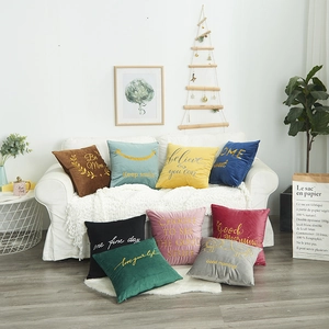 Modern velvet cushion covers with embroidered motivational phrases in multiple colors