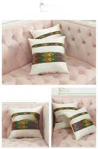 Close-up of ethnic geometric ribbon embroidery on plush velvet sofa cushion cover
