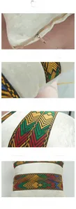 Detail of the ethnic geometric embroidery tape and invisible zipper on velvet pillow cover