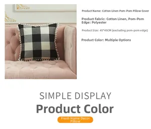 Close-up of black and white checkered cotton linen pillowcase with white pom pom fringe