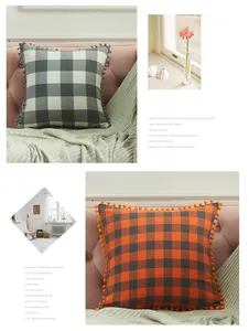 Close-up of buffalo check pillow covers with cute pom-pom trim and yarn-dyed flax texture