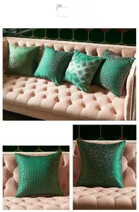 Close-up of luxury dark green cushion covers with gold textures and elegant piping detail