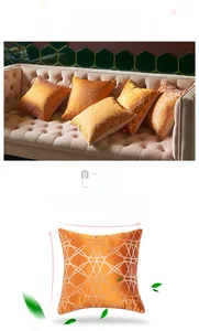 Detailed macro view of orange-gold geometric cushion cover with glossy velvet texture