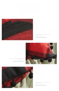 Detail of red and black buffalo plaid pillow cover with pom-poms and hidden zipper