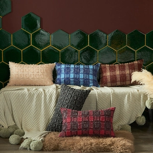 Soft textured checkered cushion covers set in beige and blue plaid on white blanket