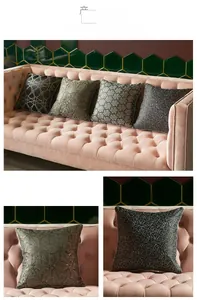 Detailed view of luxury velvet cushion covers with geometric gold and silver patterns