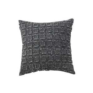 Dark grey square throw pillow cover with textured tufted checkered pattern on white background