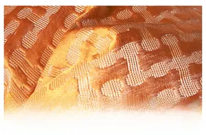 Macro shot of orange jacquard fabric with geometric textures for cushion covers