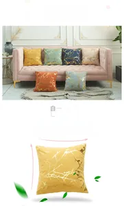 Detail of velvet pillow covers with gold foil branch patterns in various colors