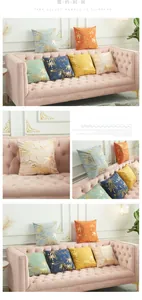 Detail of velvet pillow covers with gold foil palm tree patterns on a plush sofa