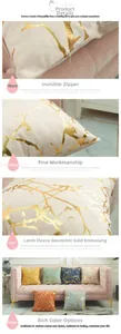 Close-up of lamb wool cushion cover featuring golden geometric branch pattern and zipper