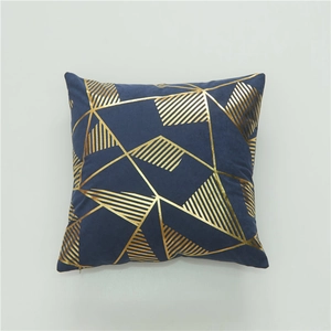 Navy blue velvet pillow cover with gold geometric pattern and hidden zipper closure