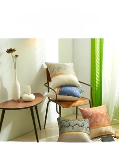 Detail of Nordic patchwork pillowcase with geometric wave patterns and gold decorative stripes