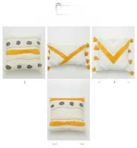 Detailed view of tufted cotton pillow covers with geometric patterns and fringe tassels