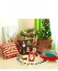 Detailed view of four festive Christmas pillowcases with pom-pom edges and gnome prints
