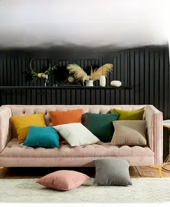 Detail view of solid color pillowcases with 3D diamond embossed texture on a sofa