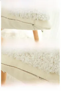 Detail of hidden zipper and reinforced stitching on tufted cotton cushion cover