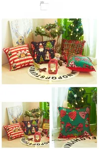 Detail of Christmas pillowcase with red pom-pom trim and festive Santa Clause patterns