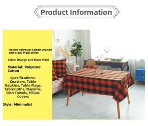 Modern orange and black plaid table runner with matching pillow covers and dinner mats