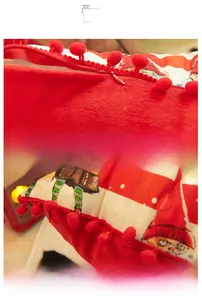 Detail of Christmas pillowcase showing the invisible zipper and red pom-pom edge craftsmanship