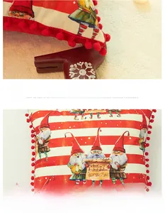 Detail of red and white striped Christmas pillowcase with pom-pom trim and Santa print