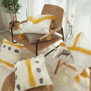 Bohemian tufted cotton pillow covers with tassels in yellow and grey geometric patterns