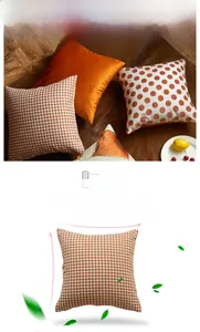 Detail showing orange polka dots and houndstooth patterns on square throw pillow covers