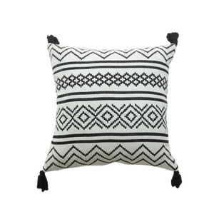 Moroccan geometric chenille throw pillow cover with black tassels on white background