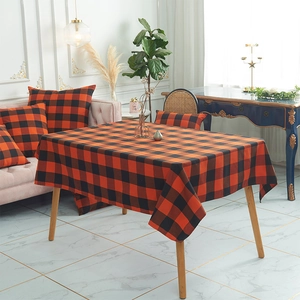 Classic orange and black buffalo plaid table runner with matching pillow covers